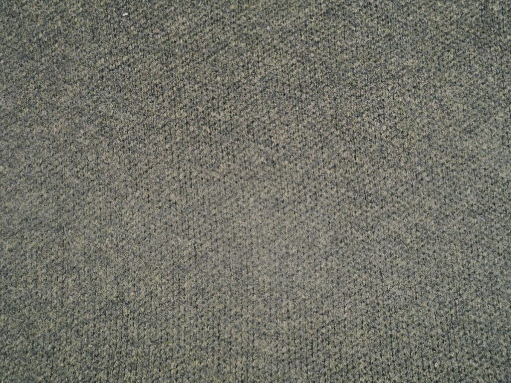 Close-up of a heather-grey twist-pile carpet