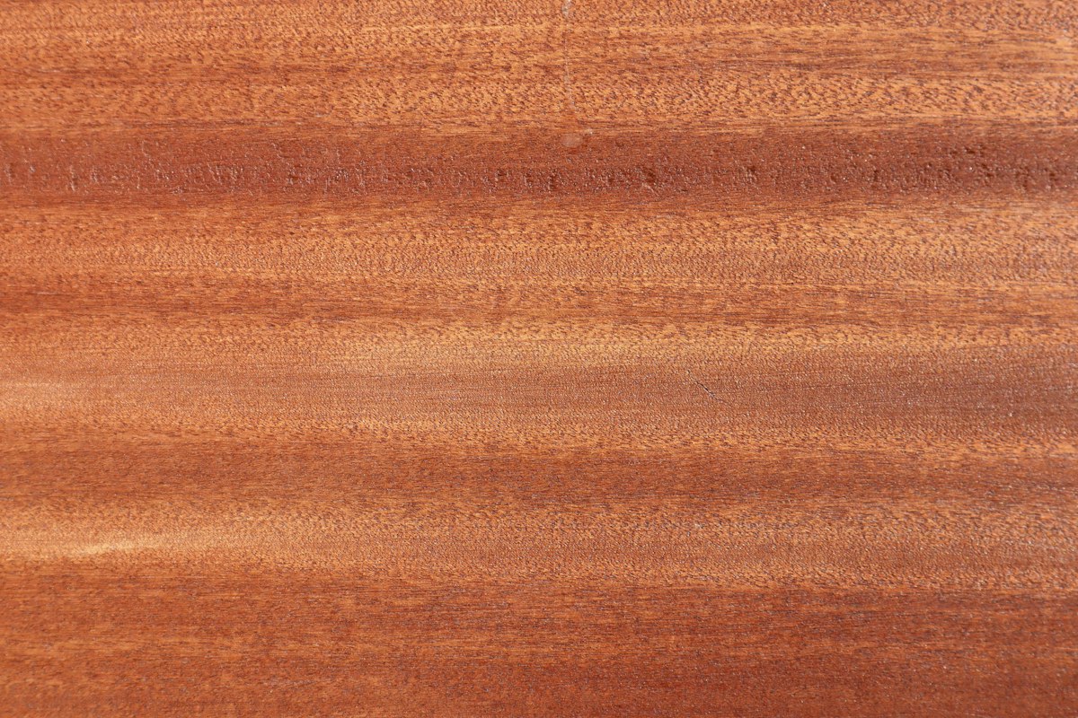 Close-up of a deep walnut laminate flooring plank