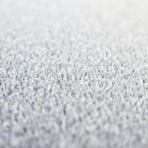 Close-up of a soft cream shag-pile carpet